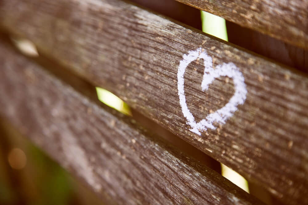Chalk heart drawn on a bench