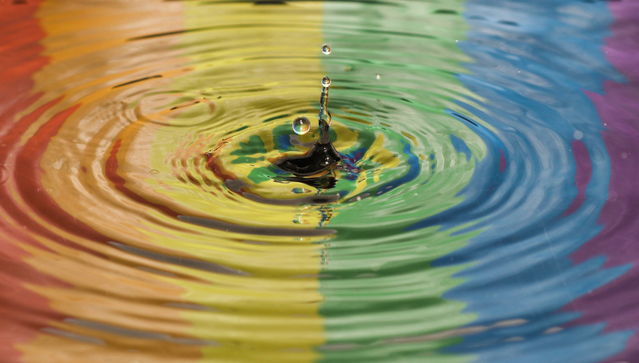 Rainbow reflected in a puddle